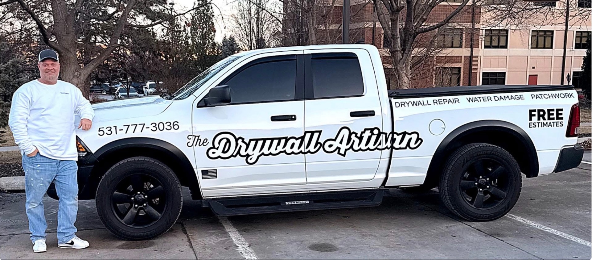 Jim — owner of The Drywall Artisan — beside the company truck in Omaha, NE